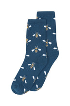 Pair of blue socks with bee pattern on a white background
